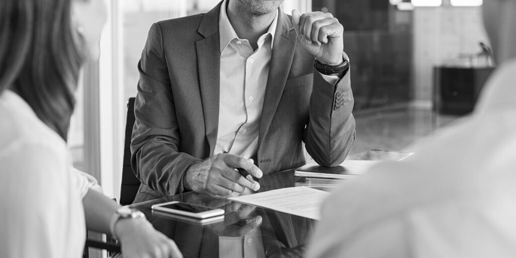 Financial advisor talking with clients - Sansiveri Forensic Accounting Accounting Firm Forensic Specialist Tax Planning Financial Experts Accounting